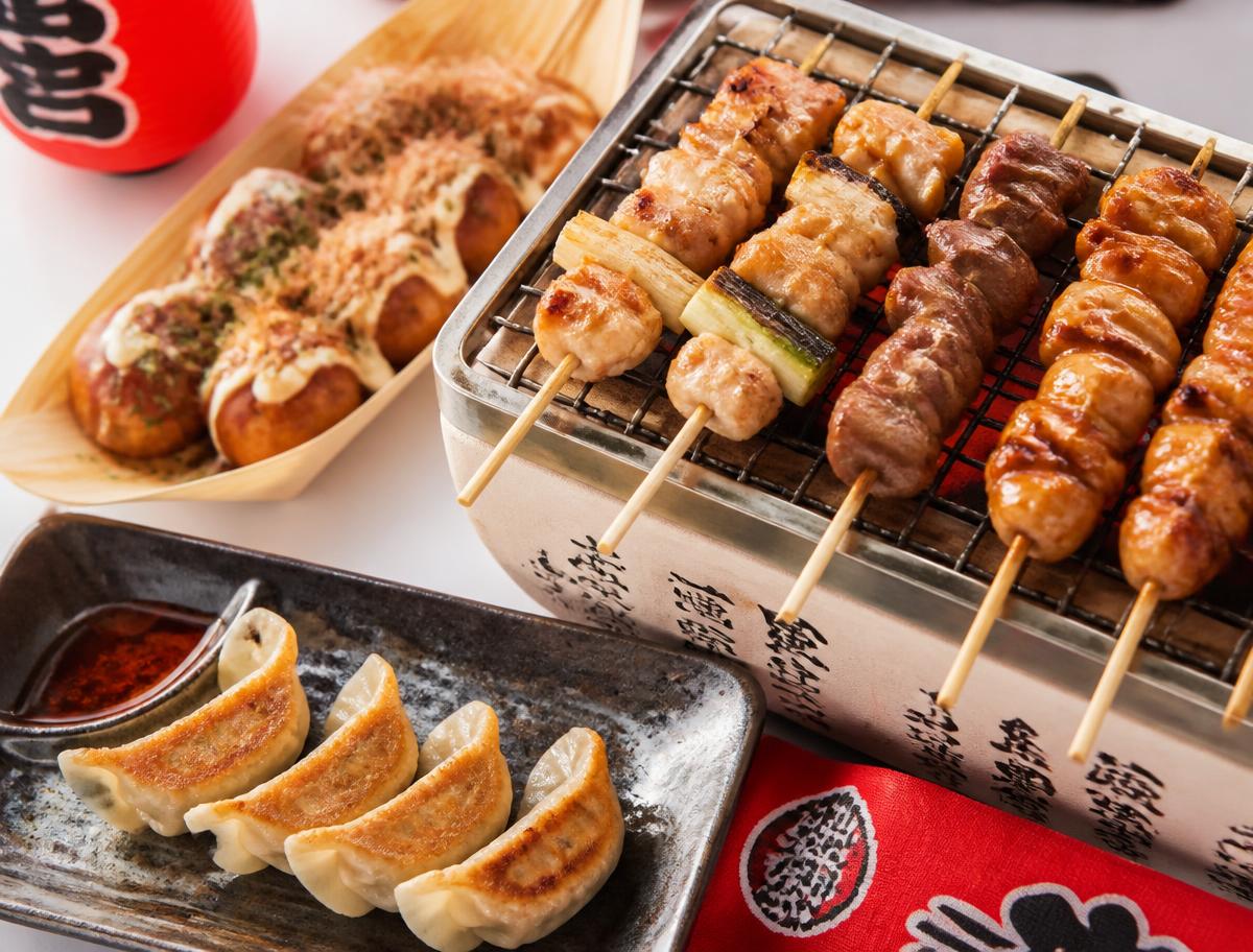 Japanese street food platter with gyoza, takoyaki and yakitori